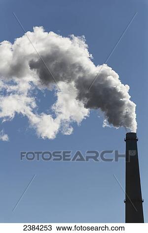 Stock Image - Smoke coming from stack of natural gas power plant, Moss Landing Power Plant; Monterey Bay, California, United States of America. Fotosearch