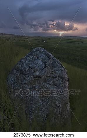 Stock Photography - Storm with lightning over the Frenchman River Valley, Grasslands National Park; Saskatchewan, Canada. Fotosearch