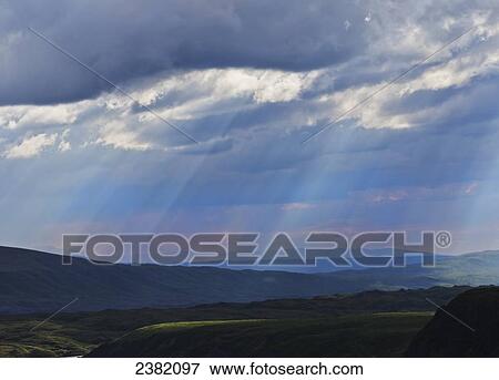Sun rays fill the summer sky at Denali National Park; Alaska, United States of America View Large Photo Image Stock Photo - Sun rays fill the summer sky at Denali National Park; Alaska, United States of America. Fotosearch