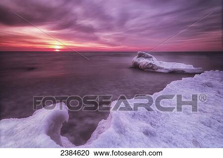 Sunrise and ice on the shores of Lake Michigan; Wisconsin, United States of America View Large Photo Image Stock Image - Sunrise and ice on the shores of Lake Michigan; Wisconsin, United States of America. Fotosearch