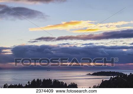 Stock Photo - Sunset near Lions Bay from the Sea to Sky Highway; Lions Bay, British Columbia, Canada. Fotosearch