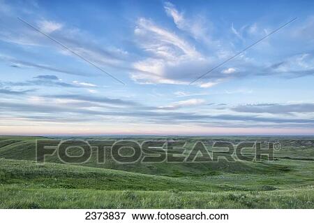 Stock Photo - Sunset sky over Grasslands National Park; Saskatchewan, Canada. Fotosearch