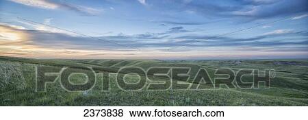 Stock Photo - Sunset sky over Grasslands National Park; Saskatchewan, Canada. Fotosearch