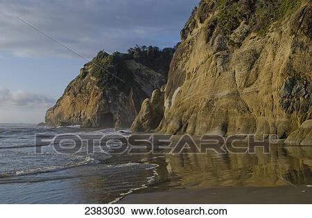 Stock Image - Surf breaks at Hug Point, Arch Cape; Oregon, United States of America. Fotosearch