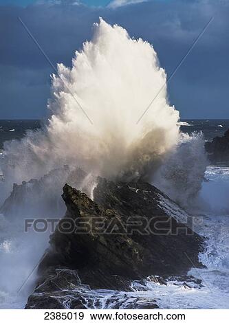 Stock Photo - Surf erupts on the rocks at Shore Acres State Park; Charleston, Oregon, United States of America. Fotosearch