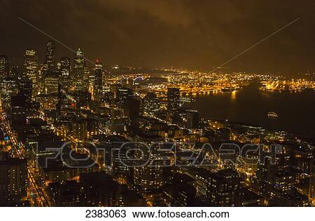 Stock Image - The lights of Seattle are viewed from the space needle at night; Seattle, Washington, United States of America. Fotosearch