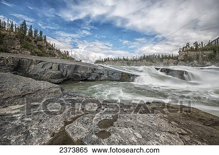 'The Sluice Box' above Virginia Falls, Nahanni National Park Reserve; Northwest Territories, Canada View Large Photo Image Stock Photography - 'The Sluice Box' above Virginia Falls, Nahanni National Park Reserve; Northwest Territories, Canada. Fotosearch