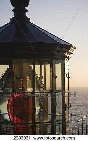 The sun sets at Cape Meares Lighthouse; Oregon, United States of America View Large Photo Image Stock Image - The sun sets at Cape Meares Lighthouse; Oregon, United States of America. Fotosearch