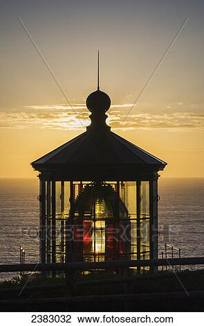 The sun sets at Cape Meares Lighthouse; Oregon, United States of America View Large Photo Image Stock Image - The sun sets at Cape Meares Lighthouse; Oregon, United States of America. Fotosearch