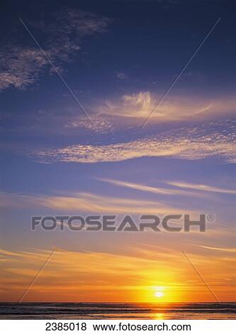 The sun sets at Umpqua Beach; Winchester Bay, Oregon, United States of America View Large Photo Image Stock Photo - The sun sets at Umpqua Beach; Winchester Bay, Oregon, United States of America. Fotosearch