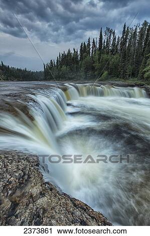 The Trout River flows over Sambaa Deh Falls in Sambaa Deh Territorial Park; Northwest Territories, Canada View Large Photo Image Stock Image - The Trout River flows over Sambaa Deh Falls in Sambaa Deh Territorial Park; Northwest Territories, Canada. Fotosearch