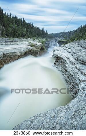 The Trout River flows over whittaker Falls on this one minute exposure; Northwest Territories, Canada View Large Photo Image Stock Image - The Trout River flows over whittaker Falls on this one minute exposure; Northwest Territories, Canada. Fotosearch