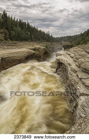 The Trout River flows over whittaker Falls; Northwest Territories, Canada View Large Photo Image Stock Photo - The Trout River flows over whittaker Falls; Northwest Territories, Canada. Fotosearch