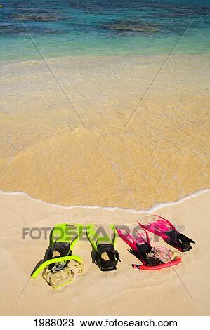 Two Sandy Snorkel Sets Rest At The Waters Edge On A Tropical Beach. View Large Photo Image Stock Image - Two Sandy Snorkel Sets Rest At The Waters Edge On A Tropical Beach.. Fotosearch