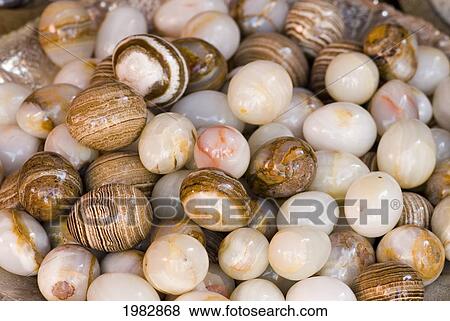 Stock Photo - Variety of stone eggs; Chiang Mai, Thailand. Fotosearch