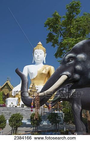 Stock Photograph - Wat Doi Kham Temple Buddha; Chiang Mai, Thailand. Fotosearch