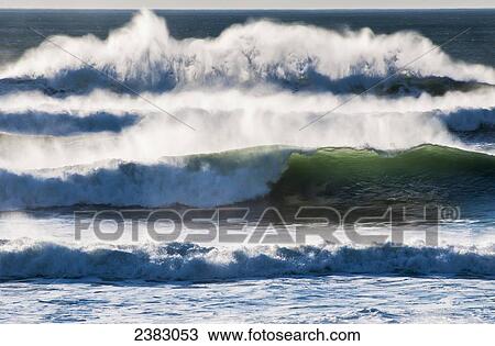 Stock Image - Waves break on the shore; Cannon Beach, Oregon, United States of America. Fotosearch
