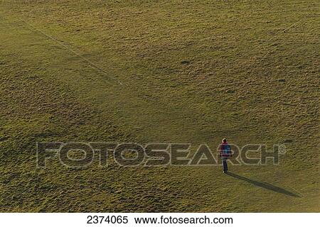 Woman walking along South West coast path near Golden Cap on the Jurassic Coast; Seatown, Dorset, England View Large Photo Image Stock Photography - Woman walking along South West coast path near Golden Cap on the Jurassic Coast; Seatown, Dorset, England. Fotosearch