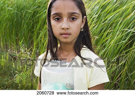 8 Year Old Girl In Wetland Holding Frog In Collecting Jar, Winnipeg, Canada View Large Photo Image Stock Photo - 8 Year Old Girl In Wetland Holding Frog In Collecting Jar, Winnipeg, Canada. Fotosearch