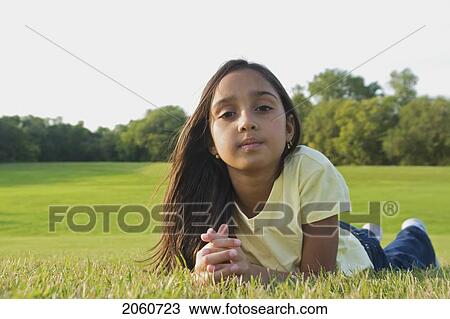 8 Year Old Girl Lying On Grass In Park, Winnipeg, Canada View Large Photo Image Stock Image - 8 Year Old Girl Lying On Grass In Park, Winnipeg, Canada. Fotosearch