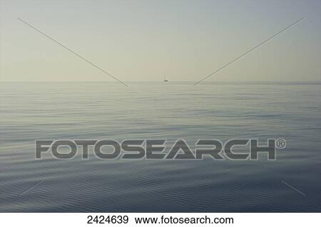 A boat in the far distance on the Mediterranean Sea; Sardinia, Italy View Large Photo Image Stock Photo - A boat in the far distance on the Mediterranean Sea; Sardinia, Italy. Fotosearch