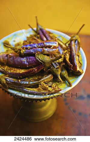 Stock Photograph - A delicacy served on a platter; Ulpotha, Embogama, Sri Lanka. Fotosearch