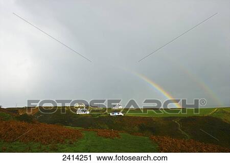 A double rainbow in the cloudy sky with houses; Aberdaron, Wales View Large Photo Image Stock Image - A double rainbow in the cloudy sky with houses; Aberdaron, Wales. Fotosearch