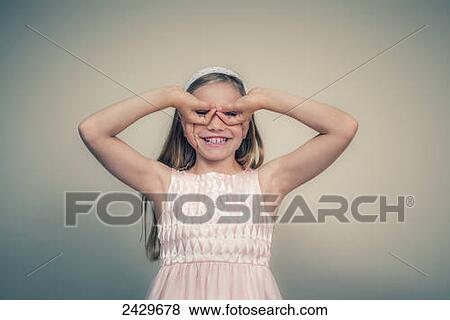 A girl makes a silly face; Connecticut, United States of America View Large Photo Image Stock Photo - A girl makes a silly face; Connecticut, United States of America. Fotosearch