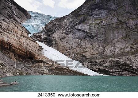 A glacier on a rugged mountain at the water's edge; Olden, Norway View Large Photo Image Stock Image - A glacier on a rugged mountain at the water's edge; Olden, Norway. Fotosearch
