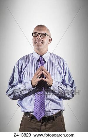 Stock Photo - A man deep in thought; Connecticut, United States of America. Fotosearch