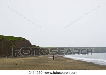 A man walks alone on a Aberdaron Beach; Wales View Large Photo Image Stock Image - A man walks alone on a Aberdaron Beach; Wales. Fotosearch