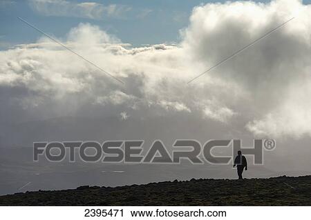 A man walks out of the clouds from the summit of Maol Chean-dearg; Torridon, Scotland View Large Photo Image Stock Image - A man walks out of the clouds from the summit of Maol Chean-dearg; Torridon, Scotland. Fotosearch