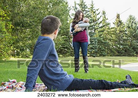 A married couple with a baby daughter in a park; Edmonton, Alberta, Canada View Large Photo Image Stock Image - A married couple with a baby daughter in a park; Edmonton, Alberta, Canada. Fotosearch