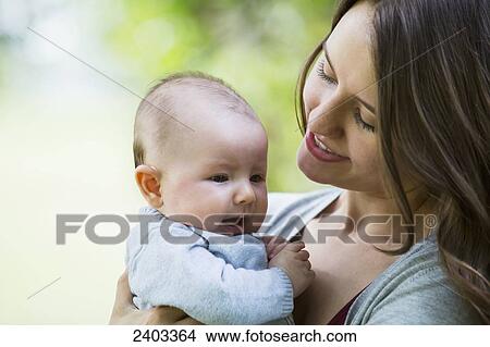 A mother with her infant daughter; Edmonton, Alberta, Canada View Large Photo Image Picture - A mother with her infant daughter; Edmonton, Alberta, Canada. Fotosearch