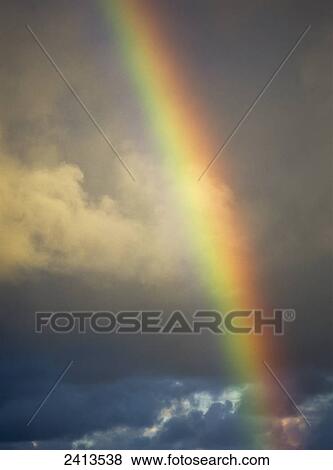 A rainbow brightens the sky; Charleston, Oregon, United States of America View Large Photo Image Stock Photo - A rainbow brightens the sky; Charleston, Oregon, United States of America. Fotosearch
