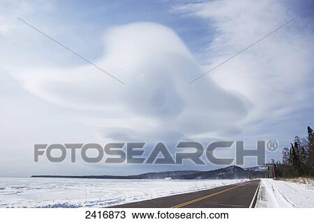 Stock Image - A road along frozen Lake Superior; Grand Portage, Minnesota, United States of America. Fotosearch