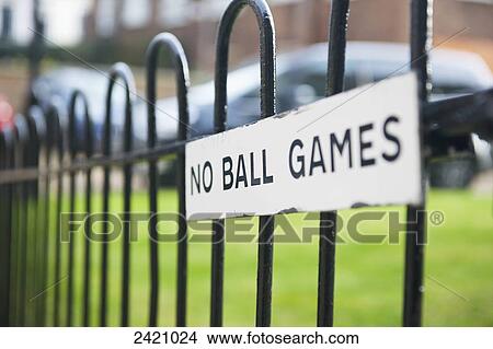 A sign on a metal fence saying no ball games; London, England View Large Photo Image Picture - A sign on a metal fence saying no ball games; London, England. Fotosearch