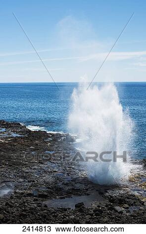 Stock Image - A spouting horn erupts; Poipu, Kauai, Hawaii, United States of America. Fotosearch