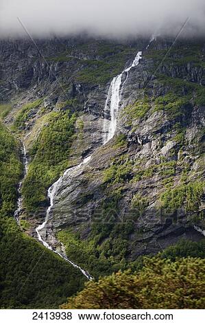 A stream running down a mountain with dense cloud; Andalsnes, Rauma, Norway View Large Photo Image Stock Photo - A stream running down a mountain with dense cloud; Andalsnes, Rauma, Norway. Fotosearch