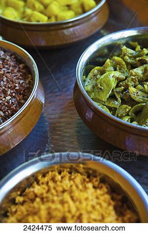 Stock Photography - A variety of food dishes in a variety of colours; Ulpotha, Embogama, Sri Lanka. Fotosearch