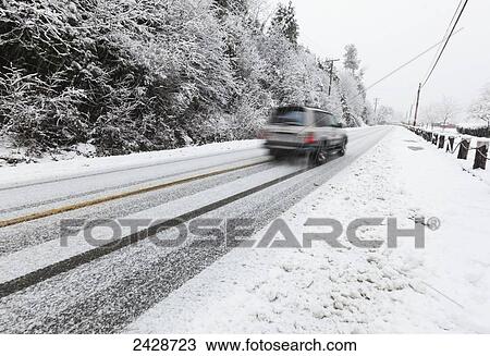 A vehicle makes its way on snow covered roads on Vancouver Island; Duncan, British Columbia, Canada View Large Photo Image Stock Image - A vehicle makes its way on snow covered roads on Vancouver Island; Duncan, British Columbia, Canada. Fotosearch
