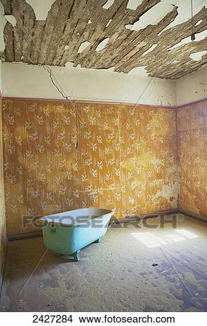 Picture - Abandoned house overtaken by advancing sand dunes of the Namib Desert; Kolmanskop, Luderitz, Namibia. Fotosearch