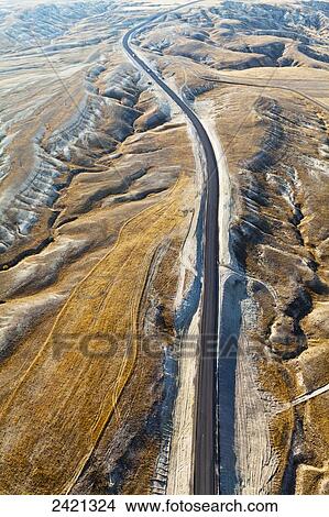 Picture - Aerial view of a road through a rugged, barren landscape; Cappadocia, Turkey. Fotosearch