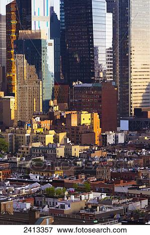 Stock Photo - Aerial view of low rise and high rise buildings in Midtown Manhattan; New York City, New York, United States of America. Fotosearch