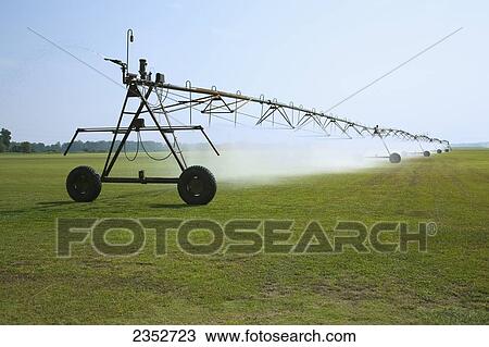 Agriculture - Center pivot irrigation of centipede grass at a sod farm / Eastern Arkansas, USA. View Large Photo Image Stock Image - Agriculture - Center pivot irrigation of centipede grass at a sod farm / Eastern Arkansas, USA.. Fotosearch