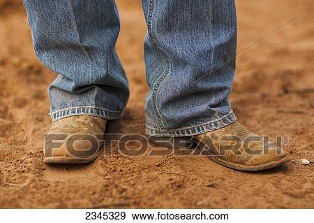 Agriculture - Detail of a farmers boots standing in a cultivated field / Childress, Texas, USA. View Large Photo Image Stock Photo - Agriculture - Detail of a farmers boots standing in a cultivated field / Childress, Texas, USA.. Fotosearch