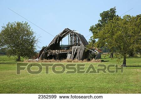 Agriculture - Old dilapidated falling down wooden barn / Arkansas, USA. View Large Photo Image Stock Photo - Agriculture - Old dilapidated falling down wooden barn / Arkansas, USA.. Fotosearch