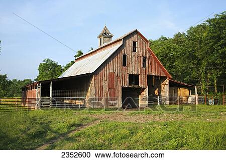 Agriculture - Old red wooden barn falling into disrepair / near England, Arkansas, USA. View Large Photo Image Stock Image - Agriculture - Old red wooden barn falling into disrepair / near England, Arkansas, USA.. Fotosearch