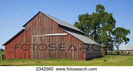 Stock Image - Agriculture - Old red wooden ranch barn / near Lodi, California, USA.. Fotosearch