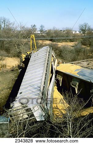 Agriculture - Railroad grain hopper cars derailed with grain leaking from the damaged cars / South Elgin, Illinois, USA. View Large Photo Image Stock Photo - Agriculture - Railroad grain hopper cars derailed with grain leaking from the damaged cars / South Elgin, Illinois, USA.. Fotosearch
